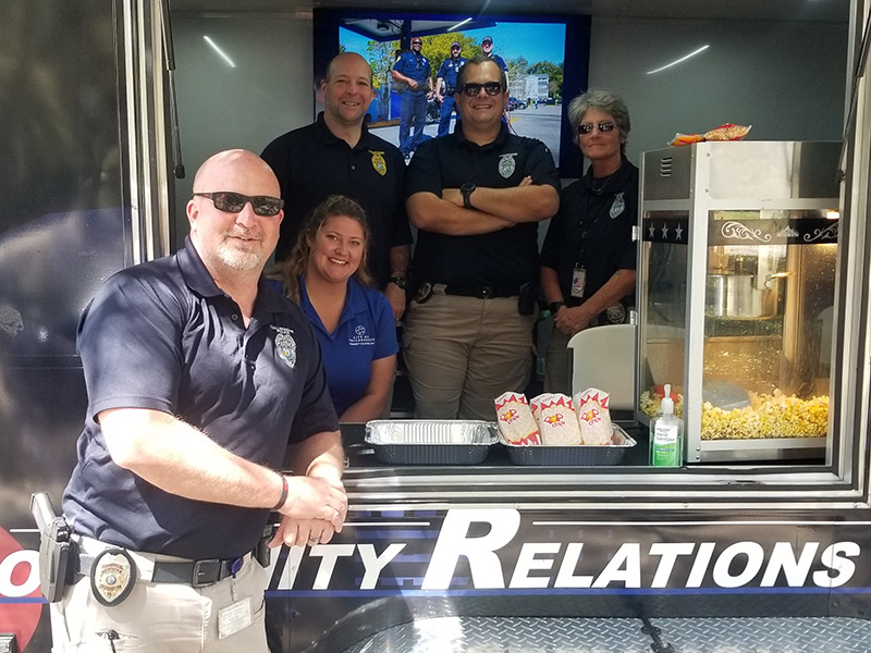 The TPD community team working a popcorn booth.